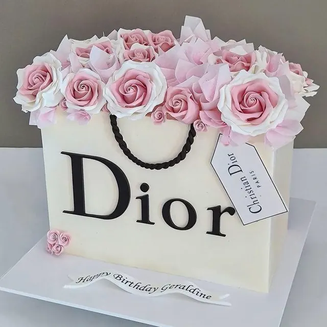 Cake designed as a shopping bag filled with pink sugar roses