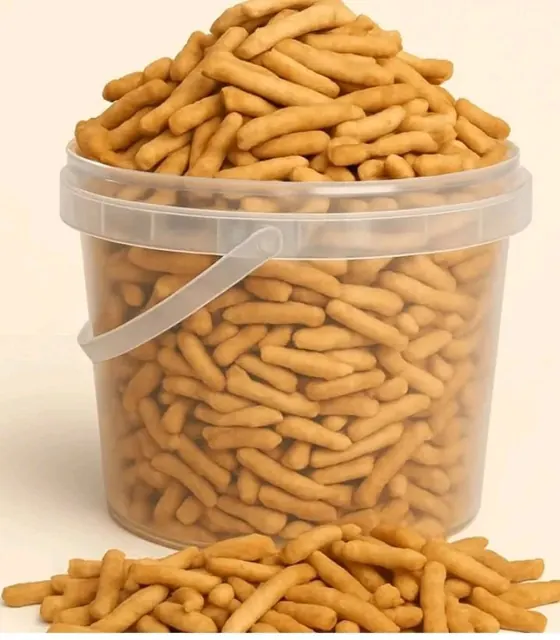 Bucket of golden chin chin sticks